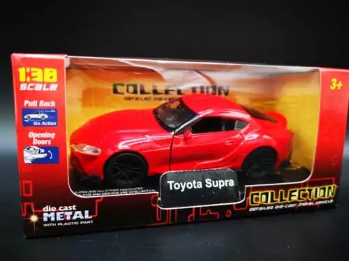 Red die-cast Toyota Supra model car (1:38 scale) with opening doors