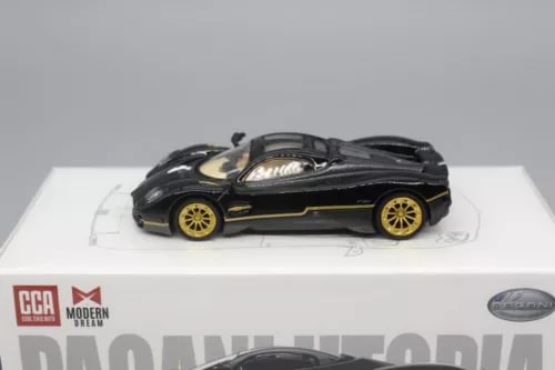 1/64 scale diecast sports car in black with gold wheels and trim