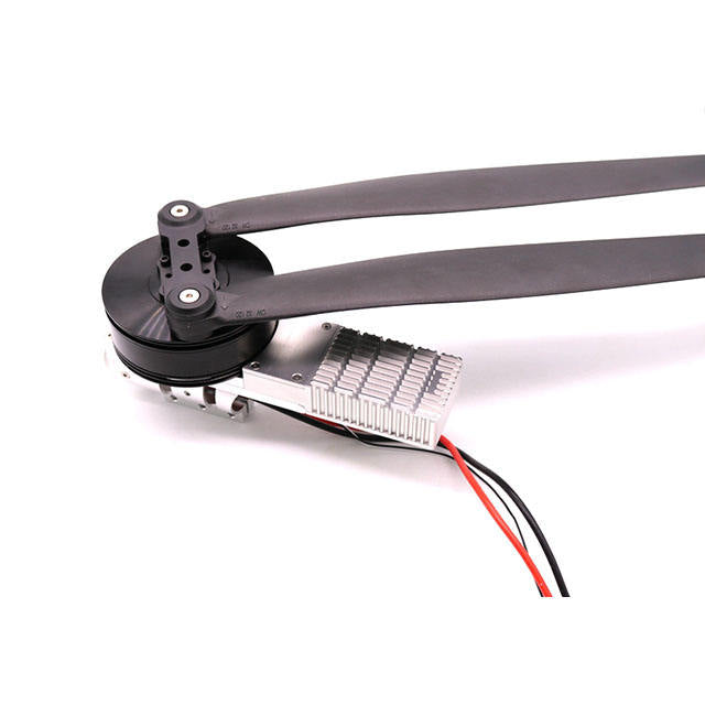 Drone propulsion motor with propeller and carbon tube, with red and black wires