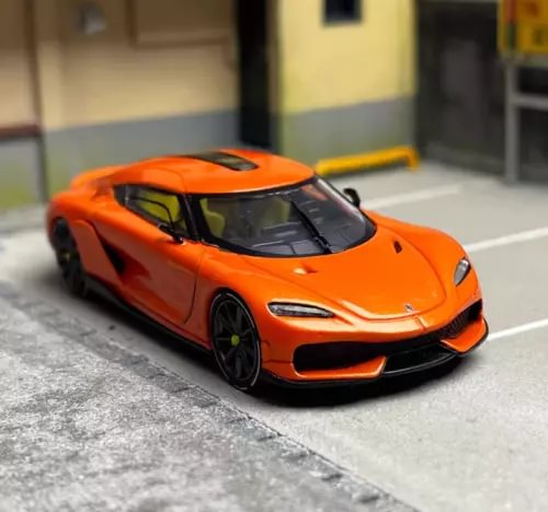 Orange diecast sports car model with black wheels and front grille detail