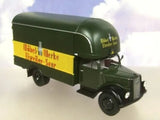 Green diecast model removal van truck with yellow panel and black wheels, side view.