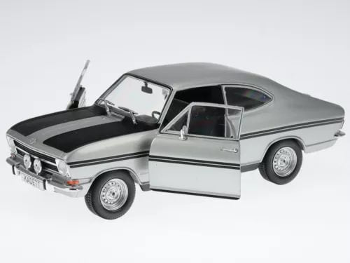 Silver diecast rally coupe model car with open hood and detailed front grille