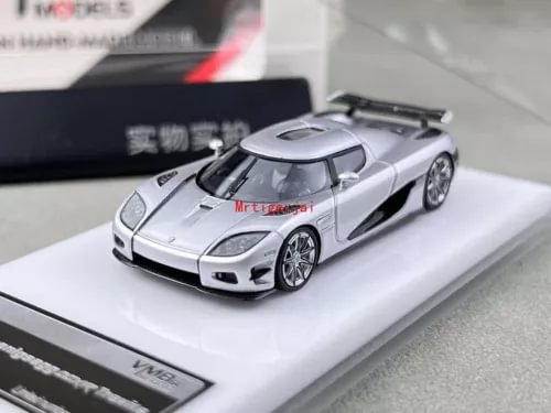 Silver racing sports model diecast car with detailed cockpit and rear wing