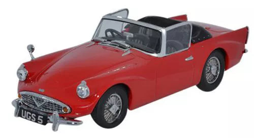 Die-cast classic sports car model in red with chrome grille and black wheels