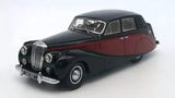 Black and red 1951 diecast model car with detailed grille and chrome bumper