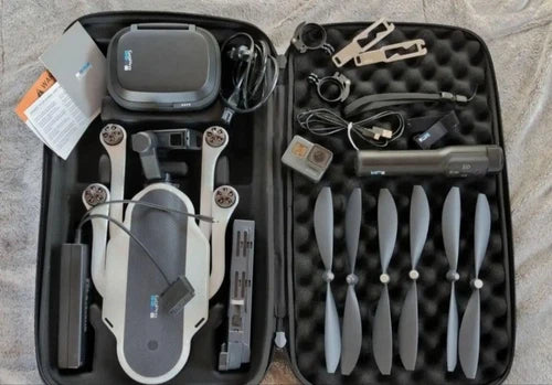 GoPro Karma drone with camera, stabilizer, and spare propellers in case