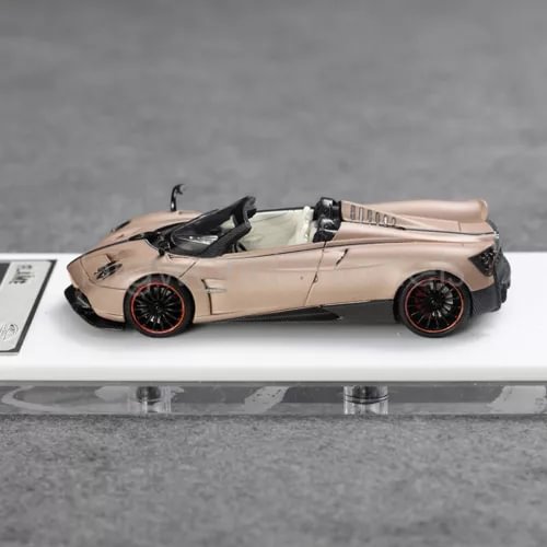 Convertible sports diecast car model in pale gold with black rear spoiler and wheels