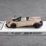 Convertible sports diecast car model in pale gold with black rear spoiler and wheels