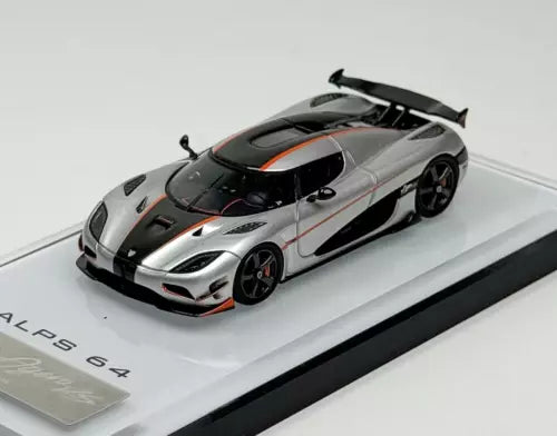 Silver super racing sports car model diecast, front 3/4 view with black accents