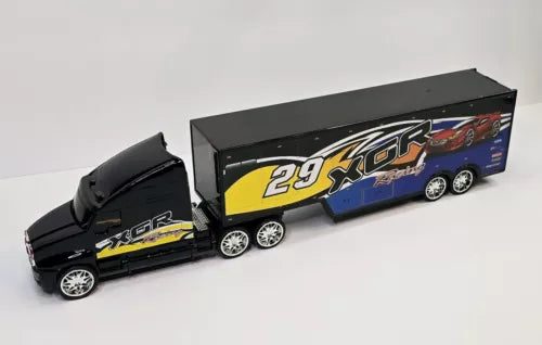 Black diecast semi truck with boxed trailer, XGR graphics, chrome wheels