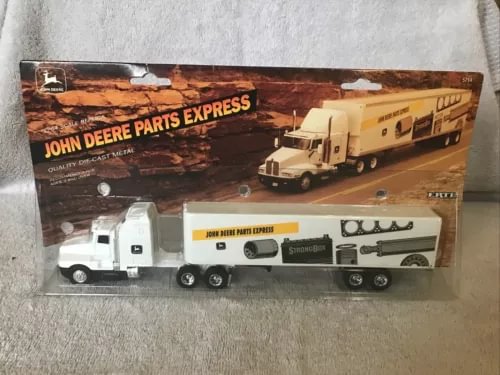 Diecast tractor-trailer toy set in beige and dark brown with white cab, 1/64 scale