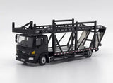 Black diecast transport truck model with open cargo frame and cab.