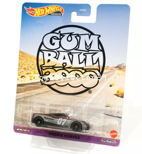 Silver diecast sports car with black details and number 07, in blister package