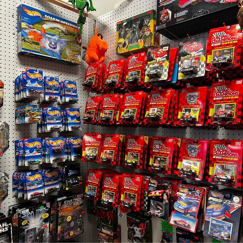 Vintage racing champ diecast car display, boxed sets in red and blue