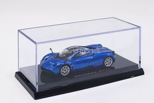 Blue diecast Pagani Huayra model car in clear display case on black base