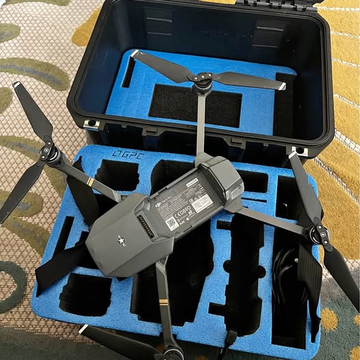 DJI Mavic Pro drone with propellers, stored in hard carrying case