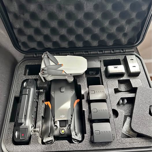 Thermal drone with gray body in hard case with accessory compartments and batteries