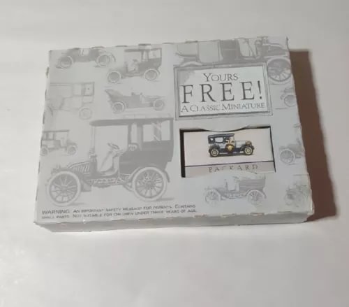 Miniature diecast car set box with Packard-style car illustration and free offer label
