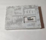 Miniature diecast car set box with Packard-style car illustration and free offer label