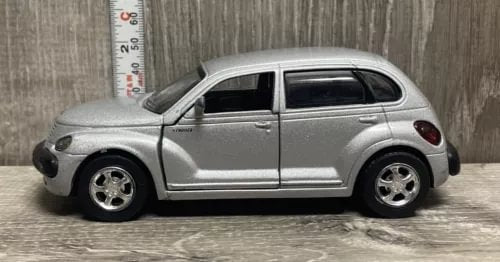 Silver diecast 2000 Pt Cruiser car, side view with detailed wheels