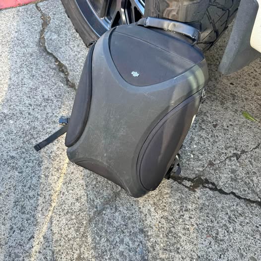 Dark gray drone backpack with front zip pocket and carrying handle straps