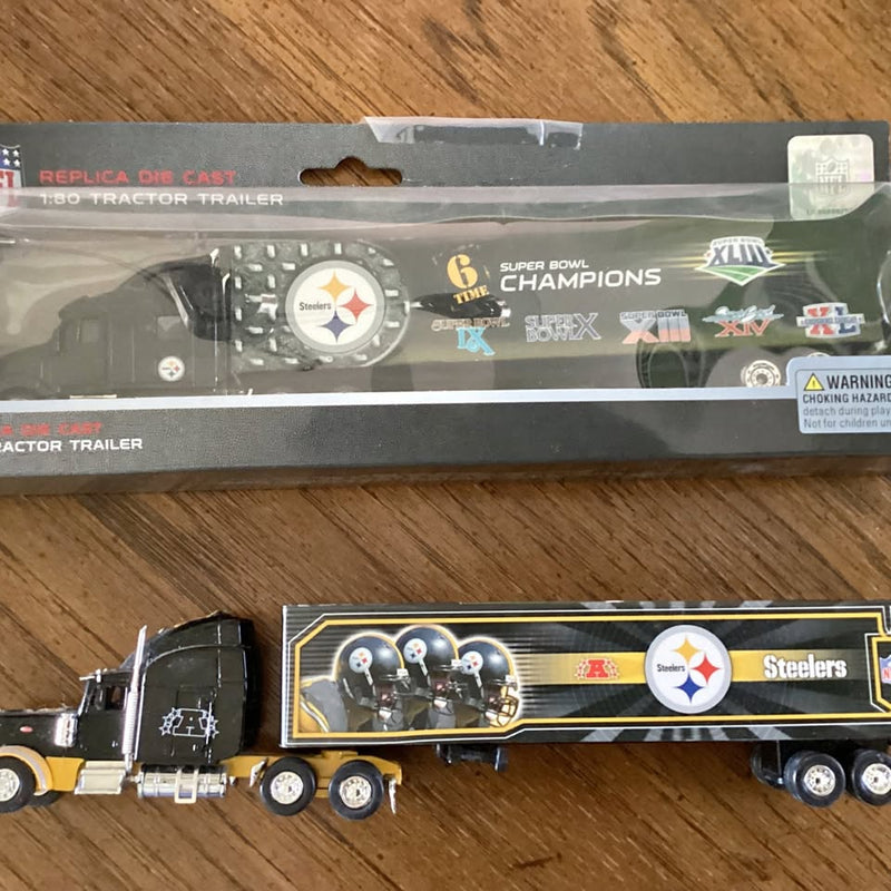 Steelers diecast semi truck with black cab and Steelers logo trailer