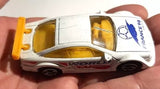 Matchbox 1:60 diecast model car, white body with yellow windows and World Cup graphics