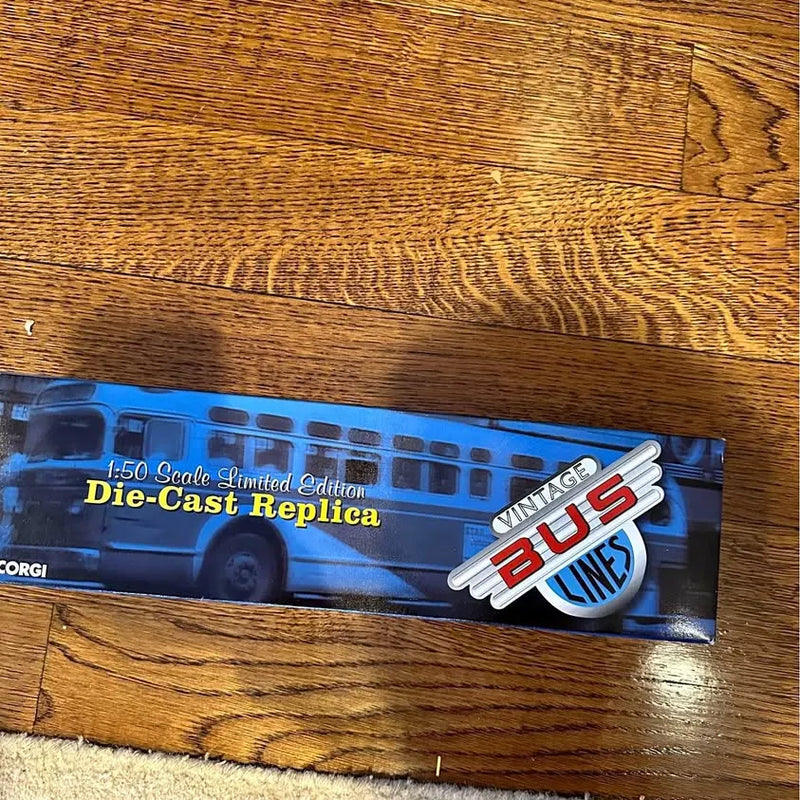 Blue die-cast replica Greyhound bus model with Vintage Bus Line graphic
