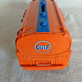 Orange diecast toy truck with Gulf logo on the front and blue interior