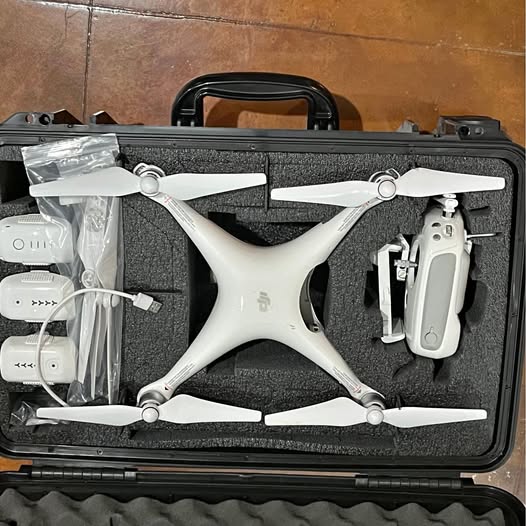 DJI Phantom 4 drone in hard case with foam cutout and folded propellers