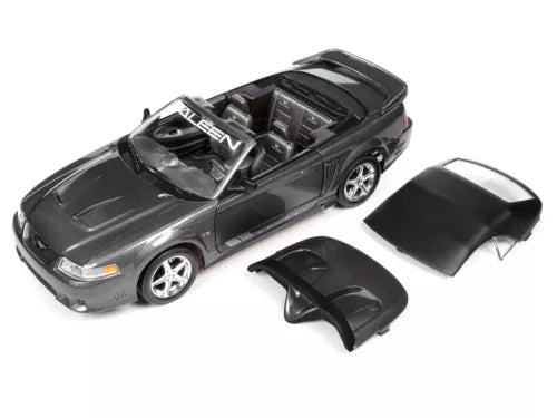 Dark gray diecast speedster model car with open hood and two spare body panels