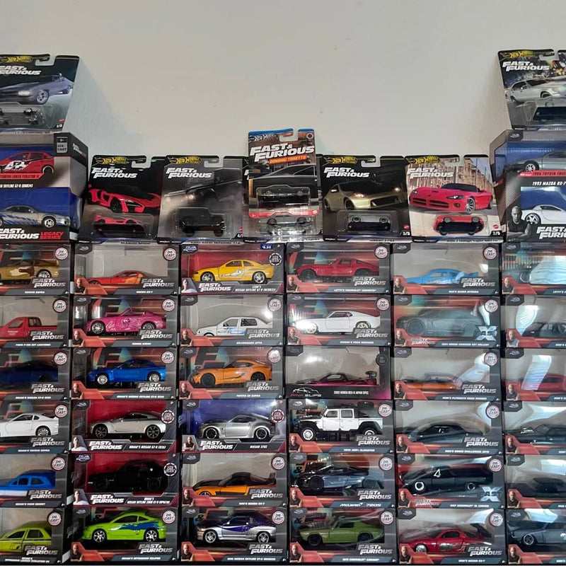 Hot Wheels diecast cars on boxed cards, assorted colors and styles.
