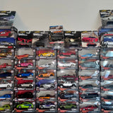 Hot Wheels diecast cars on boxed cards, assorted colors and styles.
