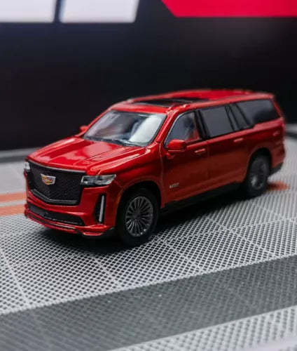 Red Escalade-style diecast metal SUV model toy with detailed grille and front lights