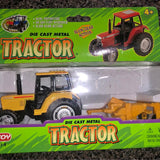 Yellow die-cast tractor with trailer, front view, detailed wheels and cab