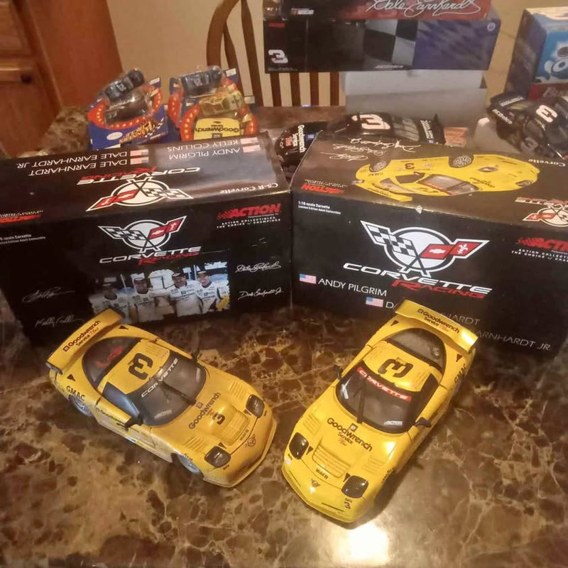 1/18 scale yellow diecast stock car with sponsor decals, shown boxed with two cars