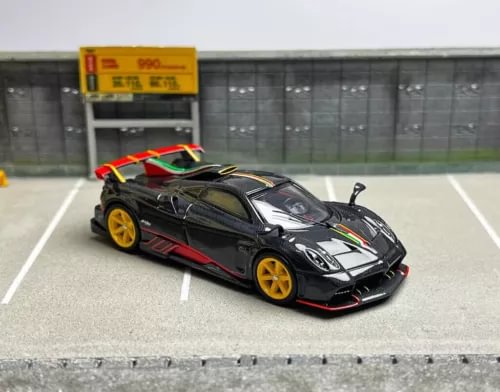 1:64 diecast racing sports car model with black body, red trim, and yellow wheels