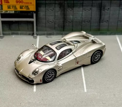 Silver metal diecast sports racing car with black racing stripes