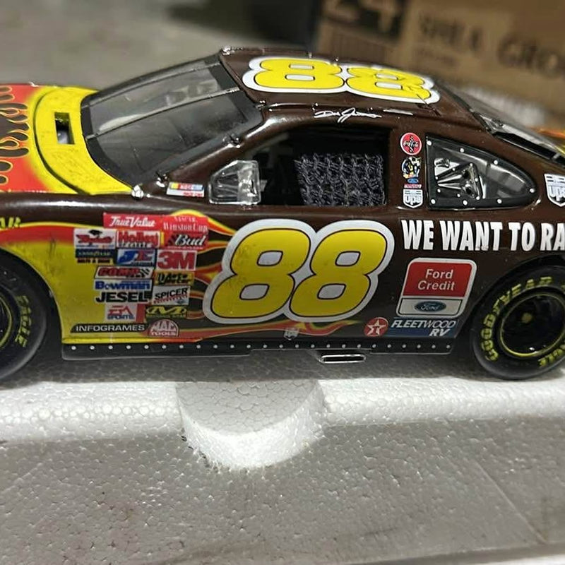 Die-cast race car model with number 88 and yellow accents, black body