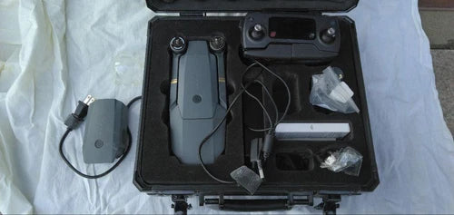 Hard case for drone accessories with foam insert, cables, and controller device inside