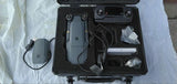 Hard case for drone accessories with foam insert, cables, and controller device inside