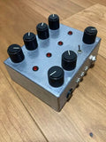RUCCI Drone Synth effects pedal with metal housing, 7 knobs, and red LED indicators
