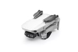 Mavic Mini quadcopter drone with front camera and folded arms, white body, gray accents
