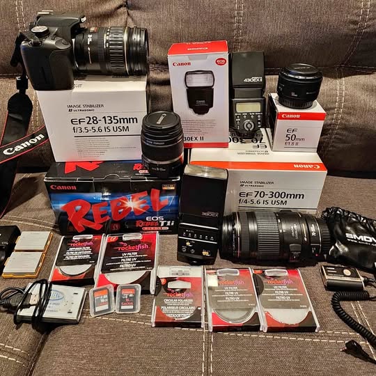 Canon Rebel EOS T1i camera kit with multiple lenses, flashes, tripod and filters