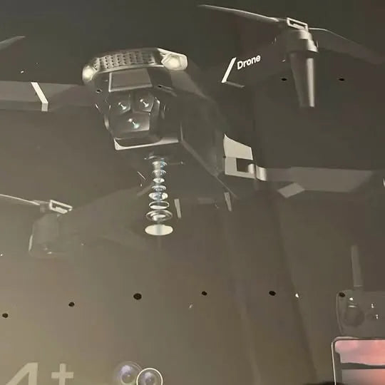 Quadcopter drone with propellers and front camera module