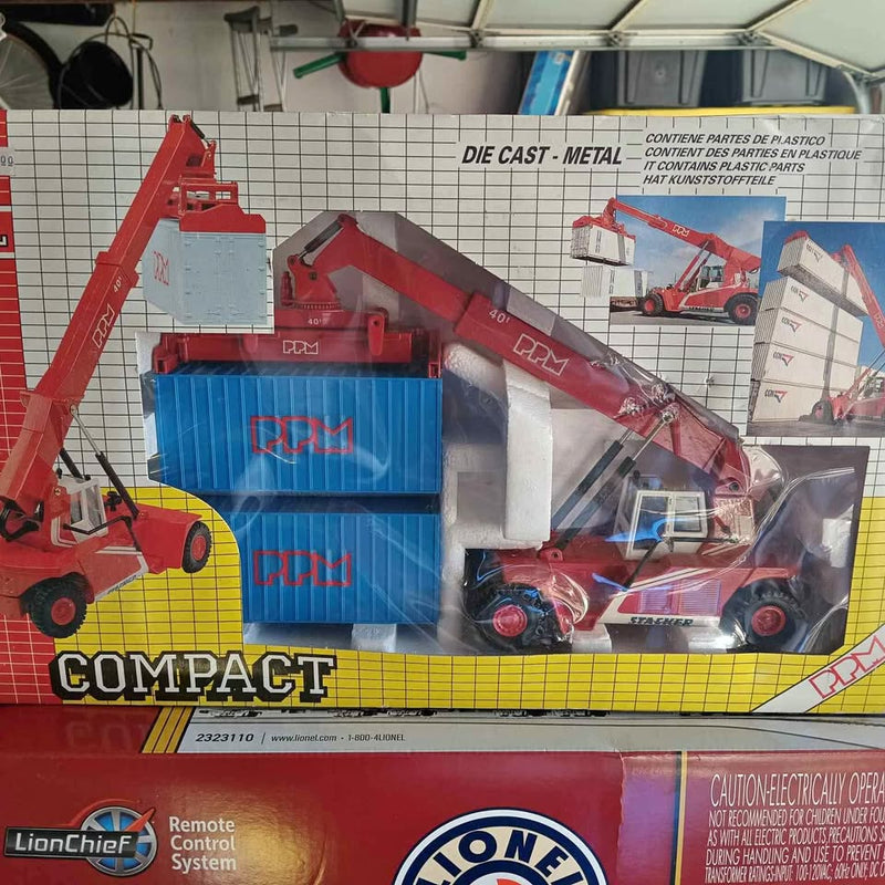 Compact diecast forklift toy with orange body and blue shipping containers