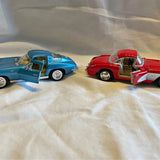 Diecast Corvette model cars, blue and red, front-quarter view