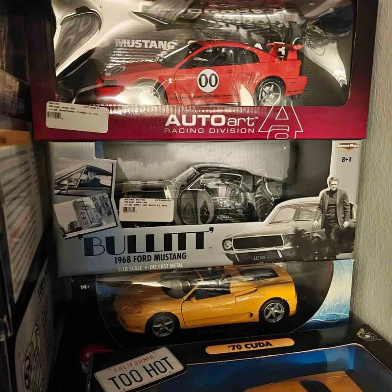 Diecast model car set in boxes with red and yellow 1/18 Ford Mustang models