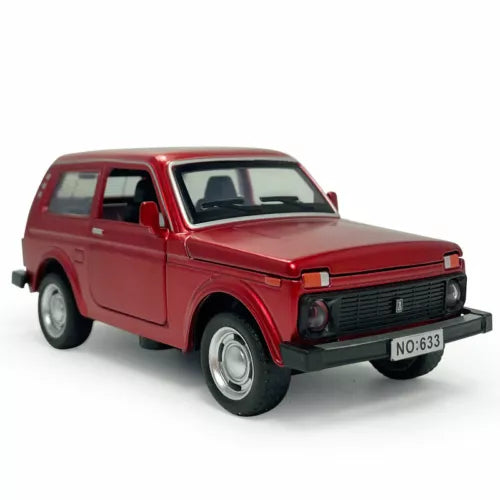 Red diecast model car with front grille and headlights, pull-back toy vehicle