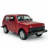 Red diecast model car with front grille and headlights, pull-back toy vehicle
